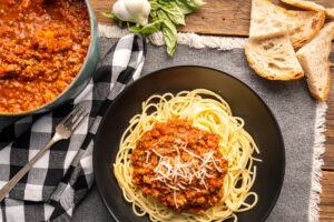 Traditional plate of spaghetti with tomato and meat sauce made with Hempler's Italian sausage.
