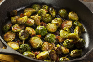 Brussels sprouts in a cast iron skillet cooked with bacon